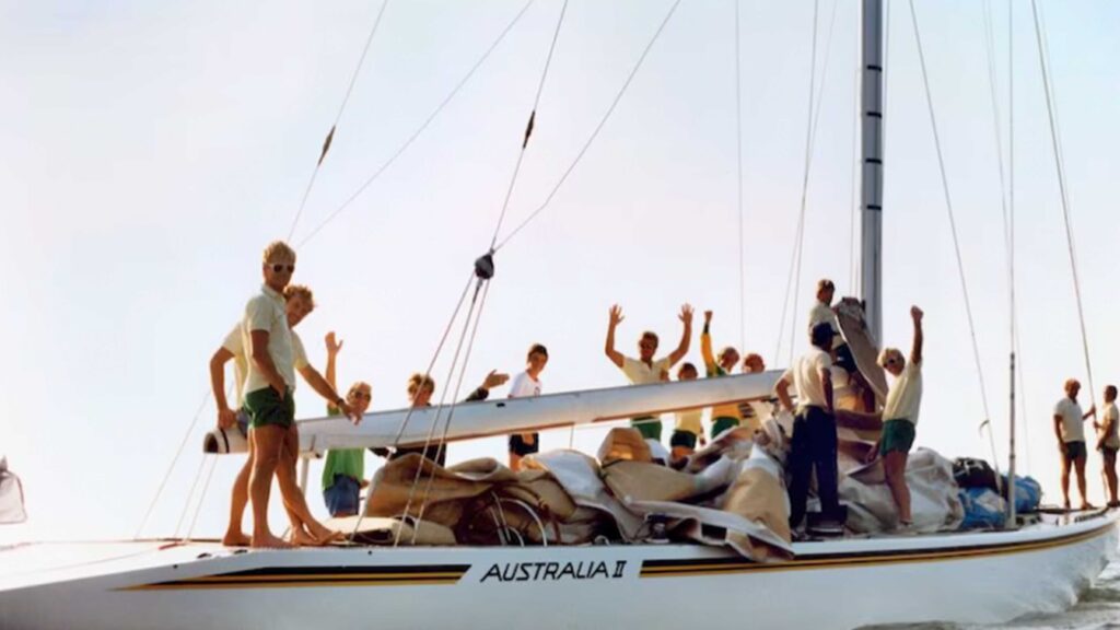 Australia II and crew celebrate 1983 win